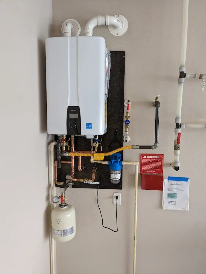 Professional plumber installing copper piping in a Hammonton home